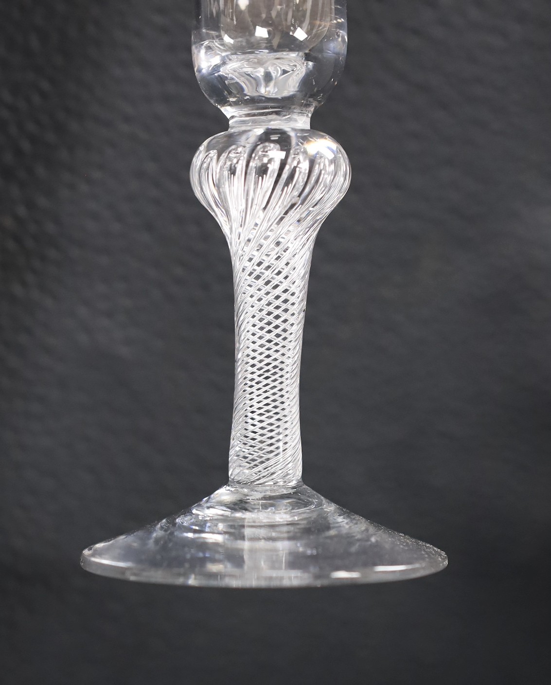A knopped air twist stem fluted glass, 18th century, 15.5cm tall